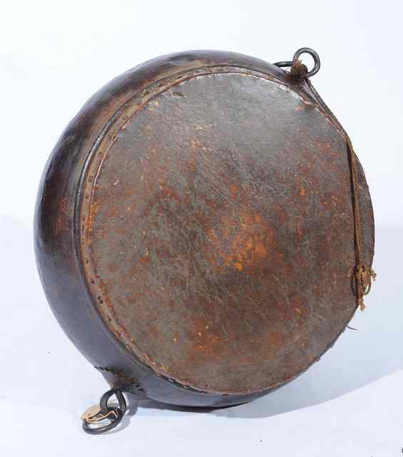 Appraisal: A TH CENTURY TIBETAN CIRCULAR CEREMONIAL DRUM with iron ring