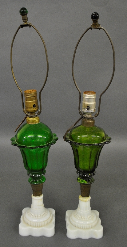 Appraisal: - Two similar green glass font fluid lamps with clambroth