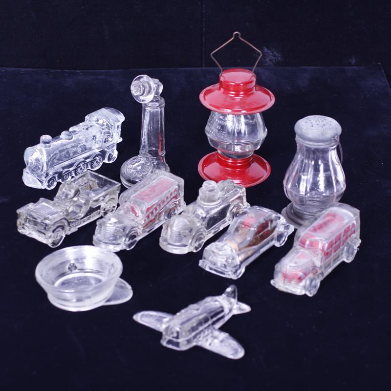 Appraisal: Lot of eleven glass candy containers automobiles train plane telephone