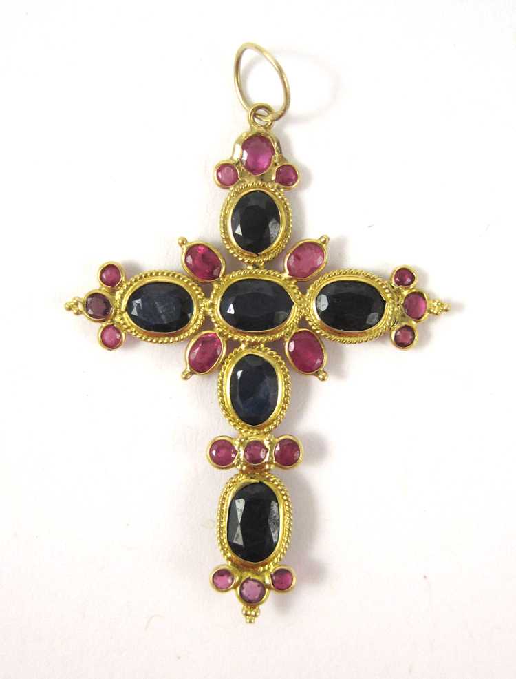 Appraisal: SAPPHIRE RUBY AND EIGHTEEN KARAT GOLD PENDANT The yellow gold