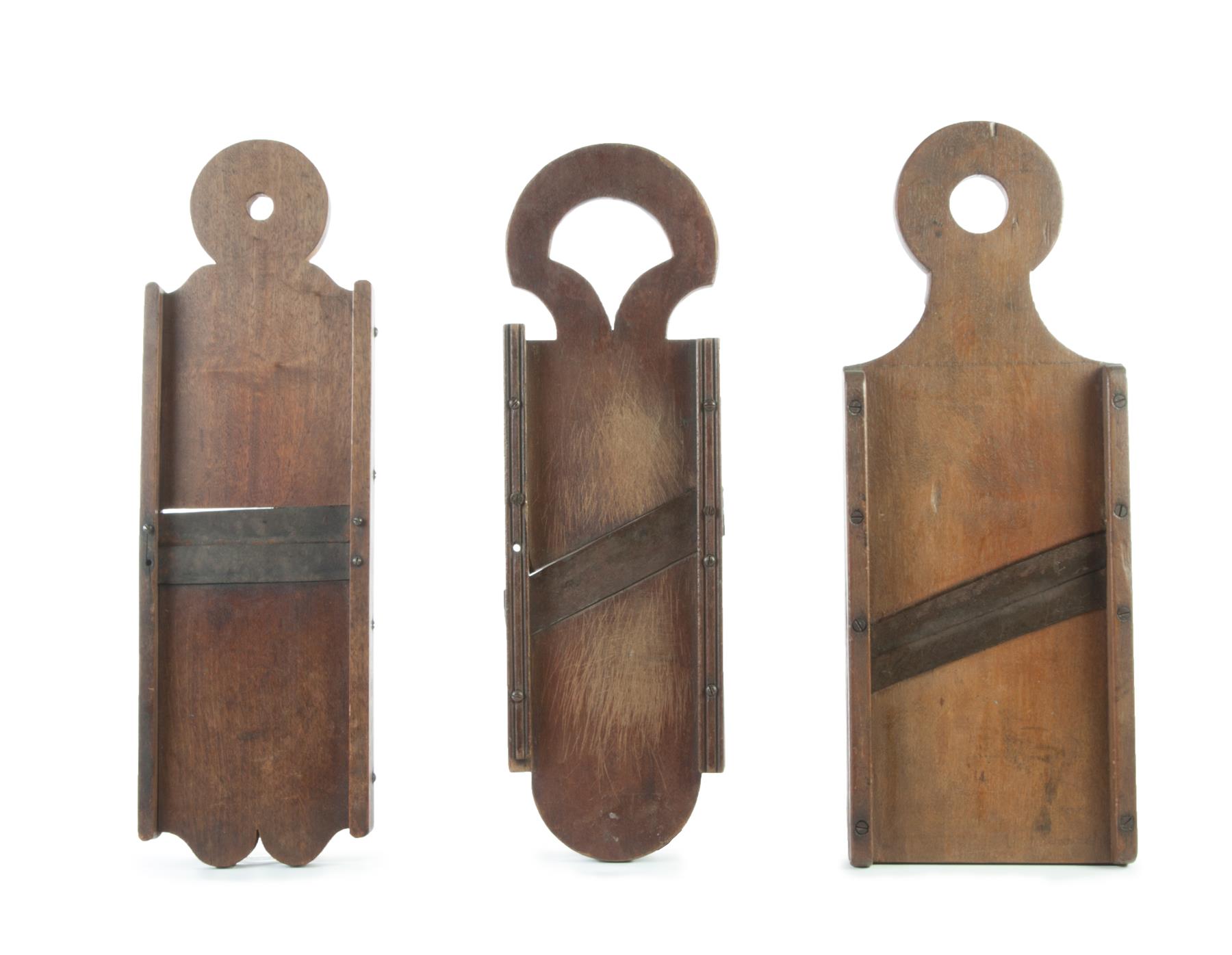 Appraisal: THREE PENNSYLVANIA KRAUT CUTTERS Nineteenth century walnut Cutout ends two