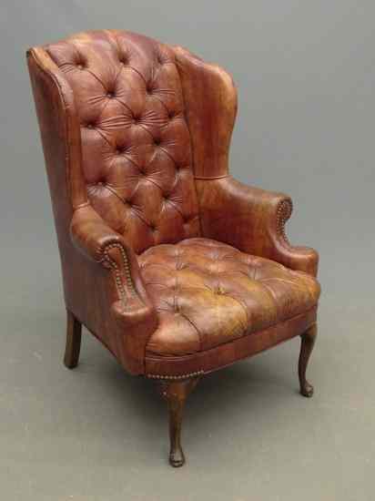 Appraisal: Tufted leather style wing chair '' Seat Ht '' Overall