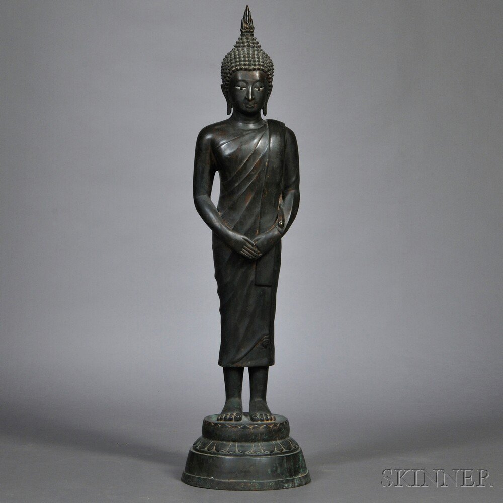 Appraisal: Bronze Buddha Thailand modeled standing on a lotus base with