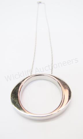 Appraisal: An K white gold Roberto Coin pendant with signature accent