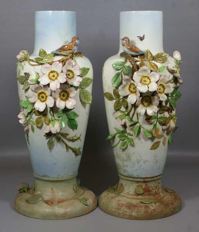 Appraisal: Leon Castel a pair of stoneware majolica vases with birds