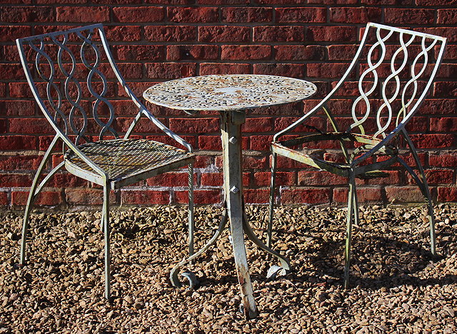 Appraisal: A CAST AND WROUGHT IRON CIRCULAR GARDEN TABLE with pierced