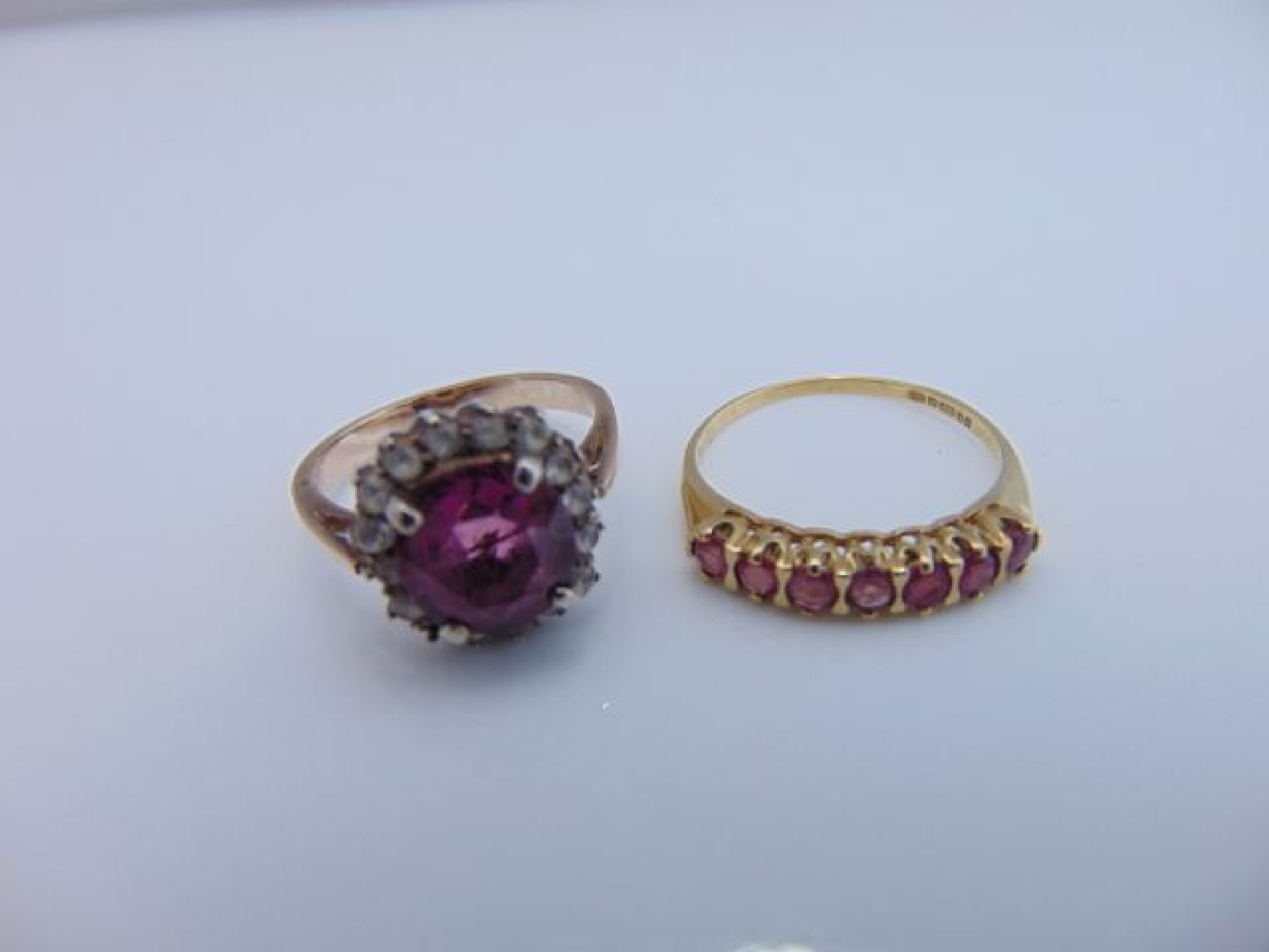 Appraisal: A ruby ring set with seven round untested rubies in