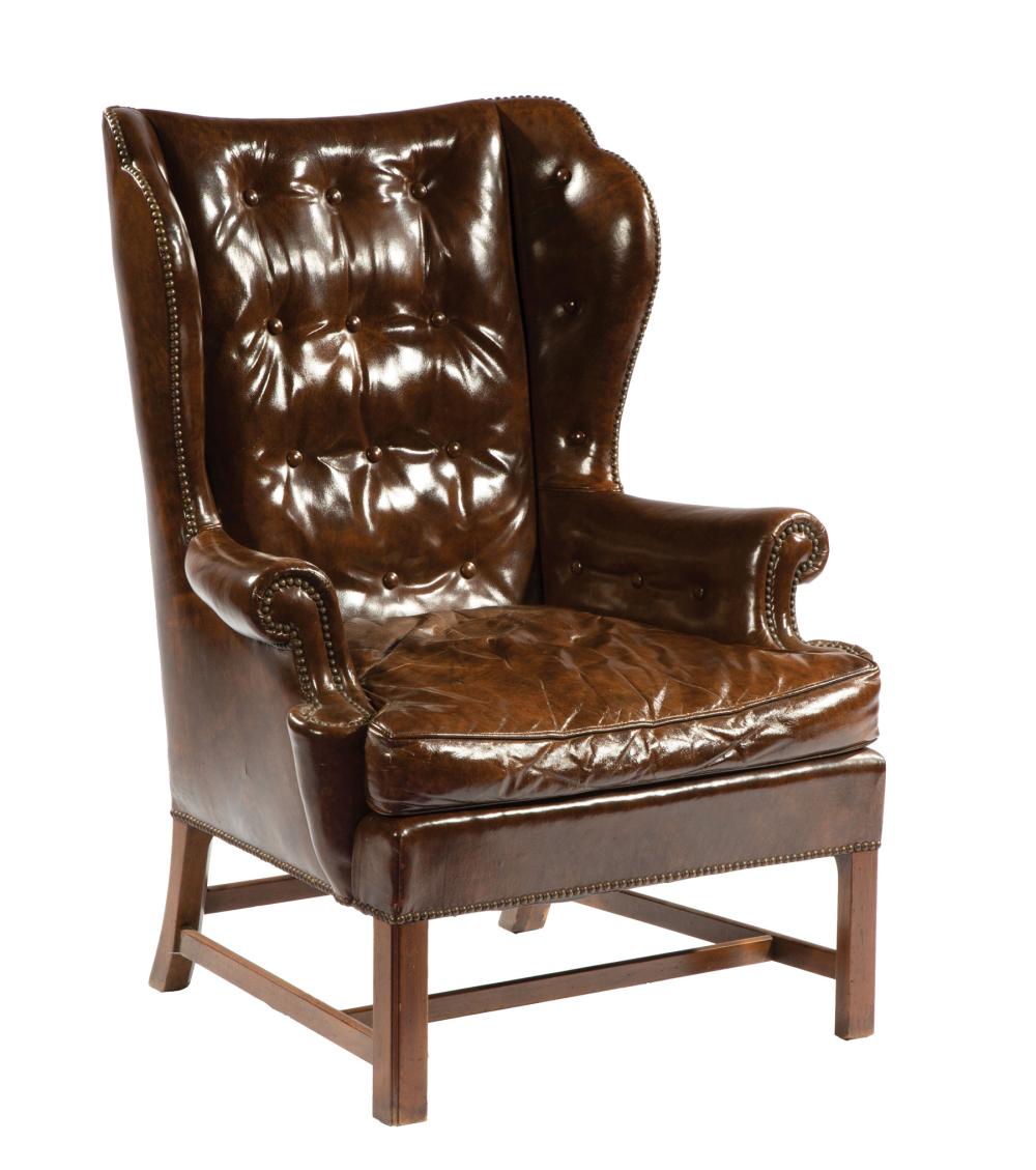 Appraisal: American Leather and Mahogany Wing Chair Baker button tufted back