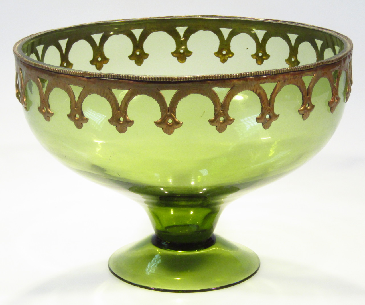 Appraisal: A Continental green glass footed bowl the circular body with