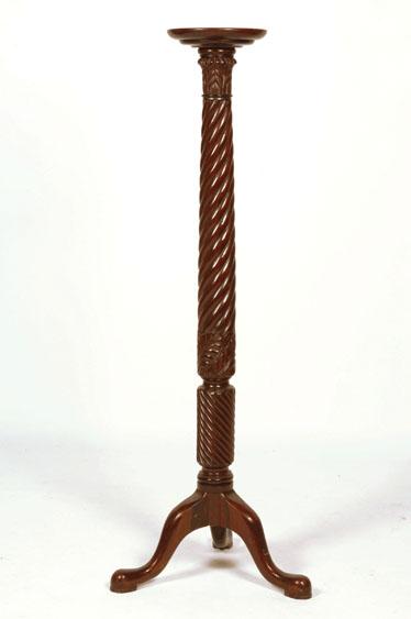 Appraisal: A VICTORIAN MAHOGANY TORCHERE with a circular turned top on