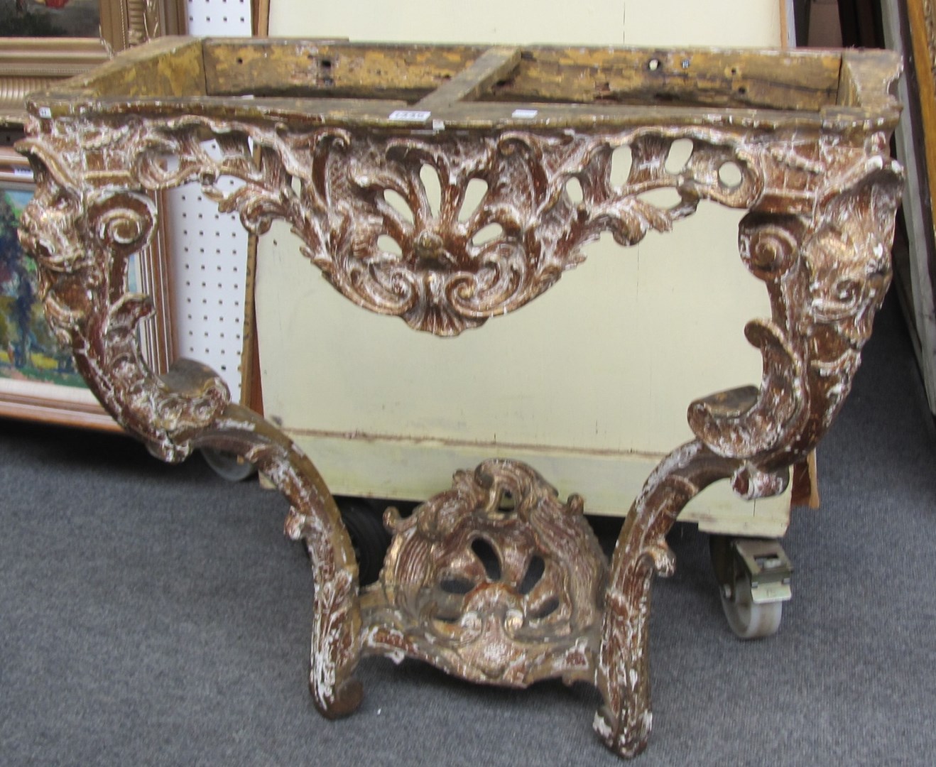 Appraisal: A late th century carved giltwood console table base with