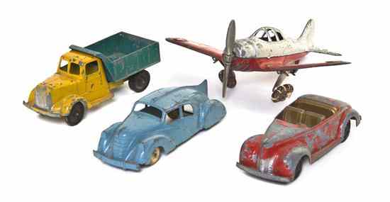 Appraisal: A Collection of Four Pressed Metal Toys comprising a U