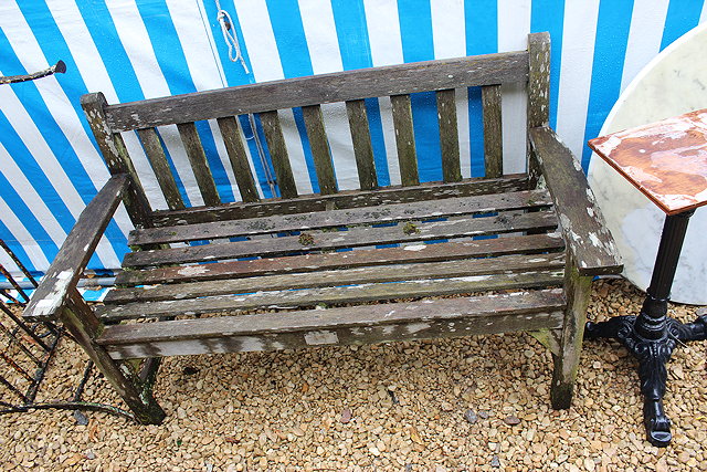 Appraisal: A SMALL TEAK GARDEN BENCH with slatted back and seat