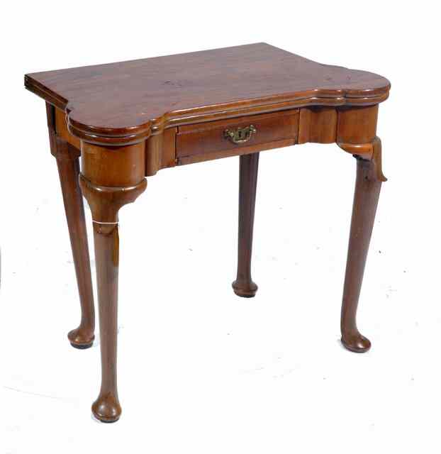 Appraisal: A GEORGIAN MAHOGANY FOLD OVER CARD TABLE with baise lined