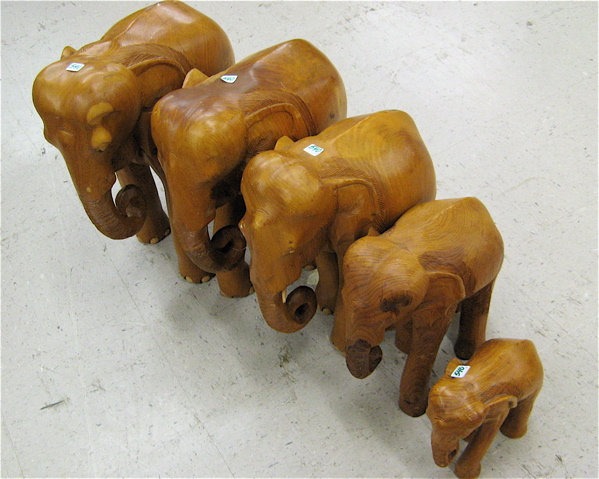 Appraisal: A FAMILY OF FIVE CARVED WOOD ELEPHANT FIGURES in graduated