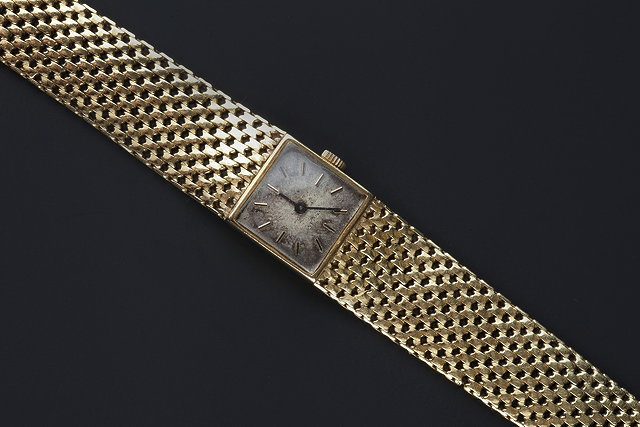 Appraisal: A LADY'S CT GOLD WRISTWATCH BY ZENITH the square signed