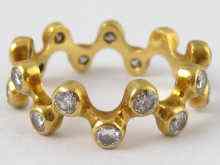 Appraisal: A yellow metal tests carat gold diamond set eternity ring