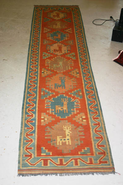 Appraisal: Kalim Runner Beige brown and teal geometric medallions containing deer