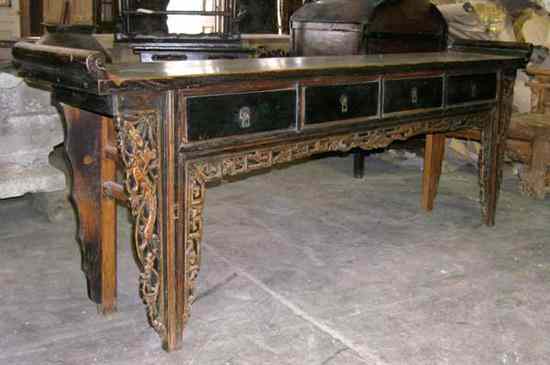 Appraisal: A Chinese Elm Recessed Trestle-Leg Altar Table th century having