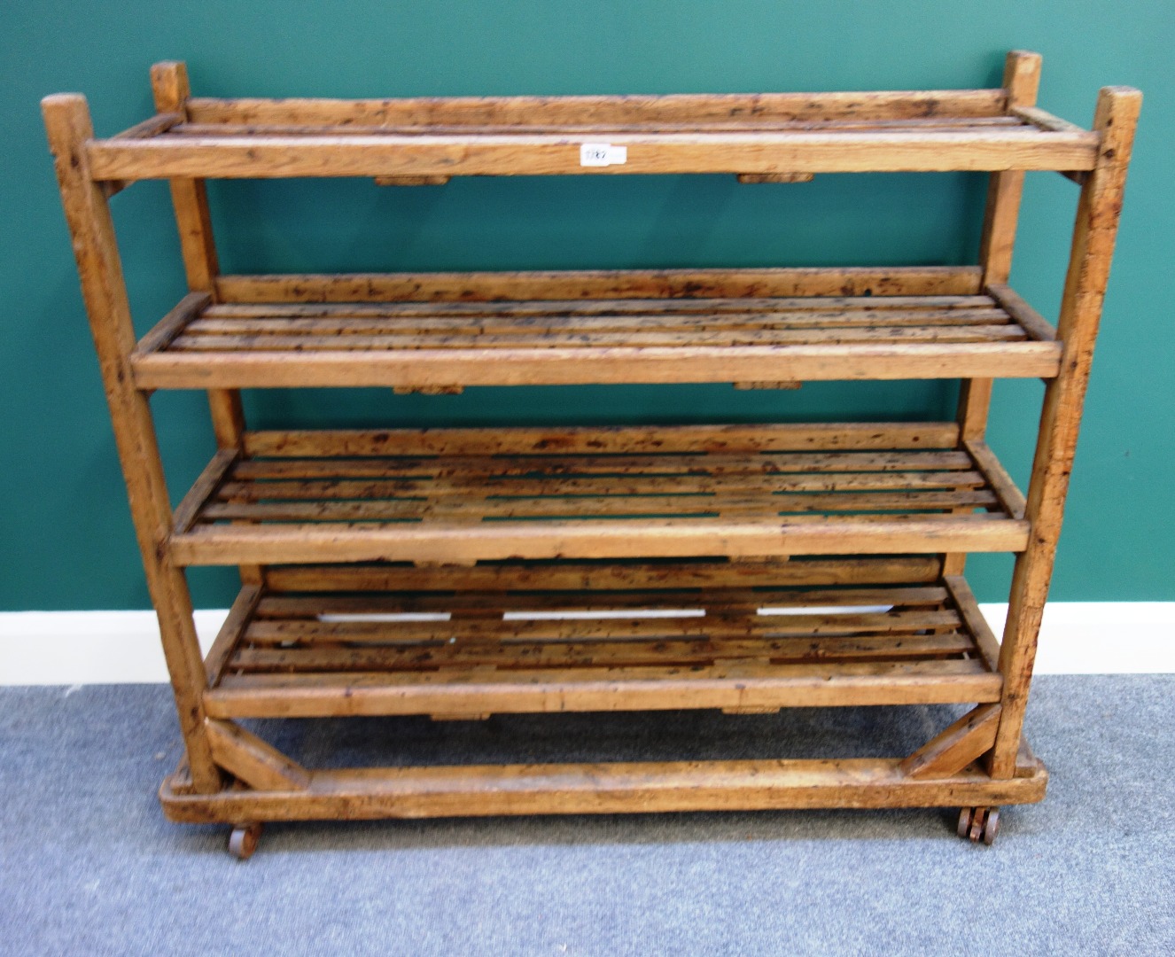 Appraisal: A mid- th century pine four tier trolley of slatted