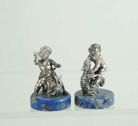 Appraisal: PAIR OF SILVER PLATED FIGURES ON LAPIS BASES Two different