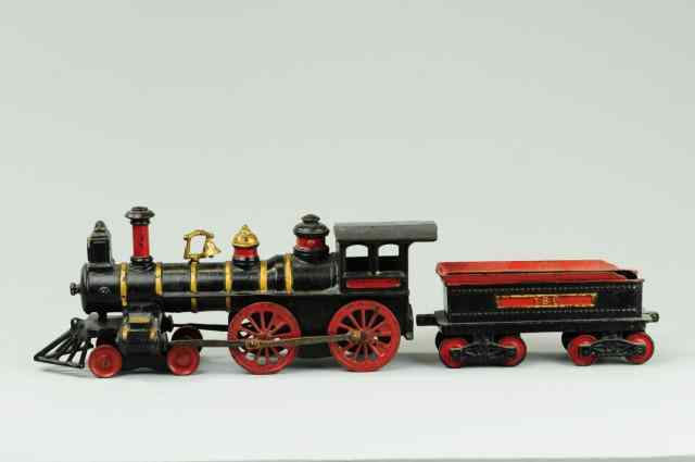 Appraisal: IVES LOCOMOTIVE AND TENDER Large cast iron example painted in