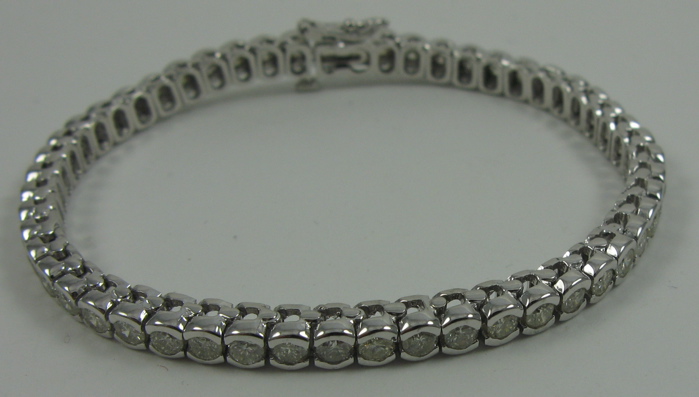 Appraisal: DIAMOND AND FOURTEEN KARAT WHITE GOLD BRACELET in length and