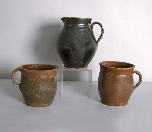 Appraisal: Redware pitcher h together with mush mugs th c h