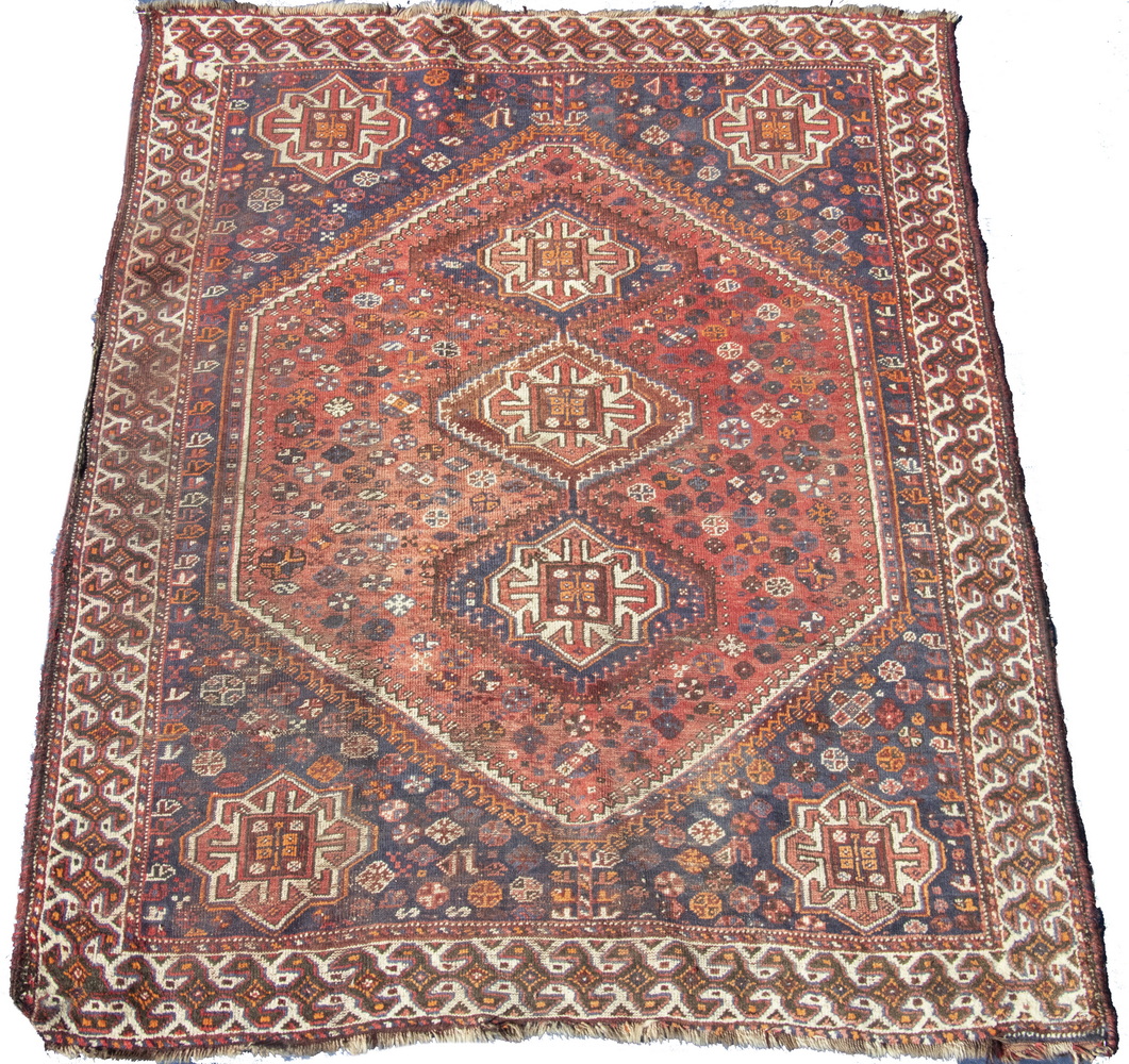 Appraisal: QASHGAI CARPET Three stepped diamond medallions in ivory aubergine and