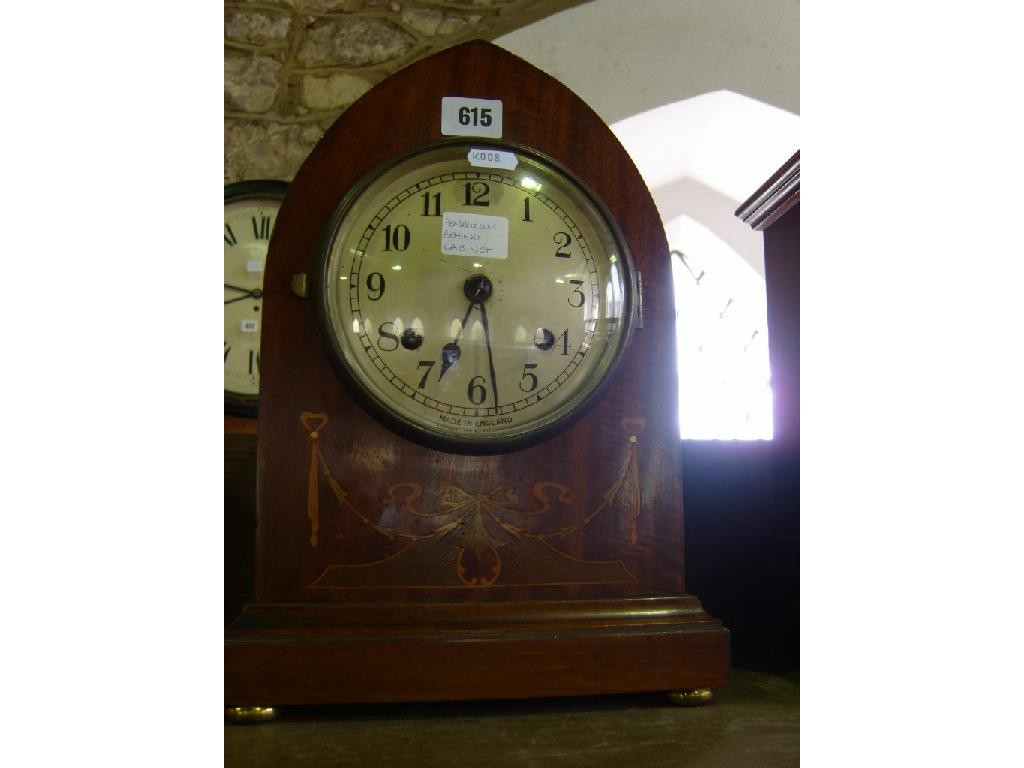 Appraisal: An Edwardian mahogany lancet shaped mantle clock with inlaid detail