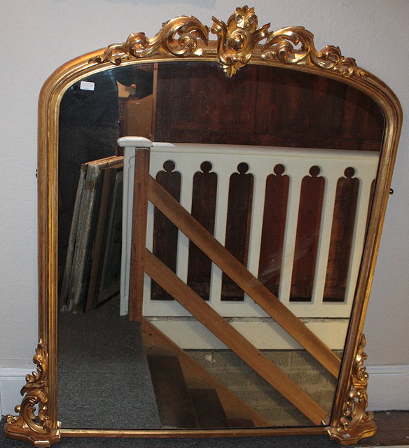 Appraisal: A VICTORIAN GILT OVERMANTEL MIRROR with scroll cornice cm x