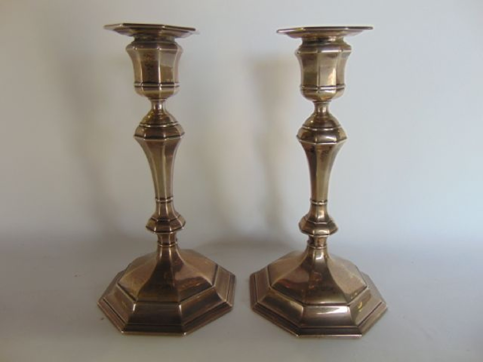 Appraisal: A pair of Edwardian silver candlesticks William Hutton Sons Ltd