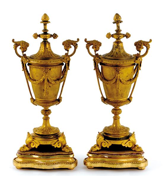 Appraisal: Pair of Louis XVI style gilt-bronze cassouletes fruit finial on