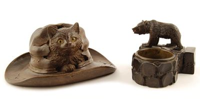 Appraisal: A Black Forest carved and stained wood 'cat in a