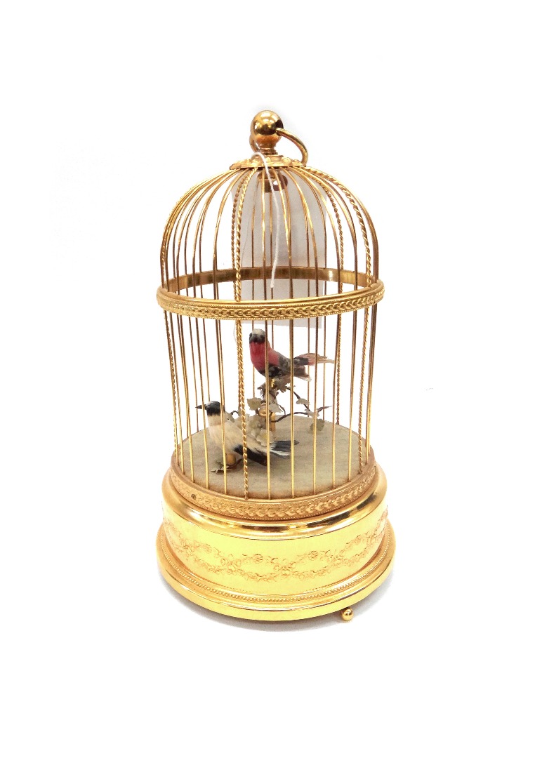 Appraisal: A Swiss reproduction singing bird cage bird automaton music box