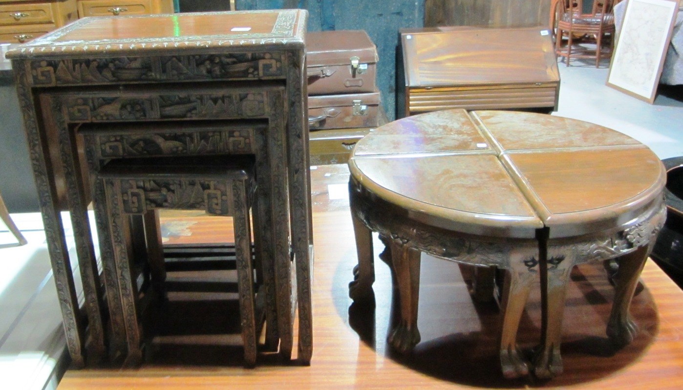 Appraisal: A carved hardwood nest of three Oriental tables and four