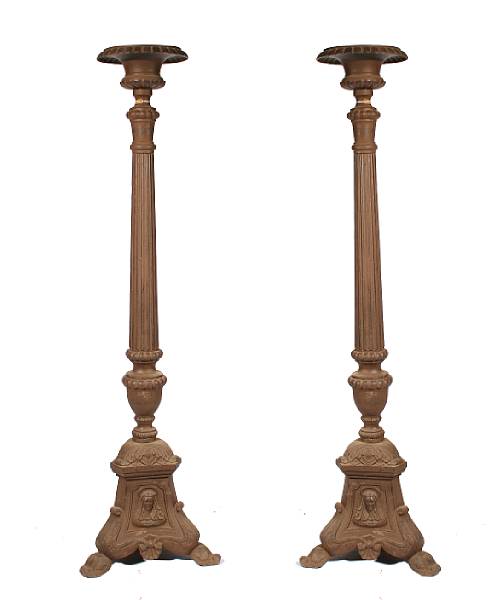 Appraisal: A pair of Baroque style large wrought iron floor prickets