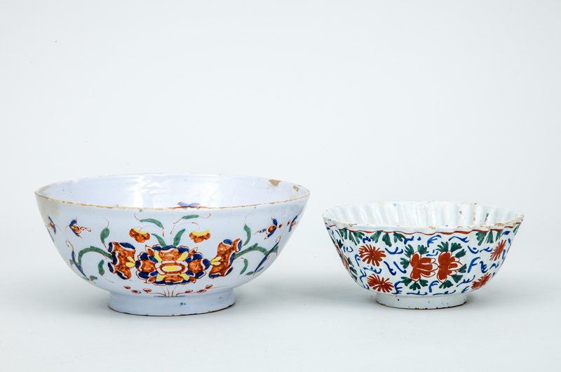 Appraisal: TWO DUTCH POLYCHROME DELFT BOWLS Unmarked the larger decorated with