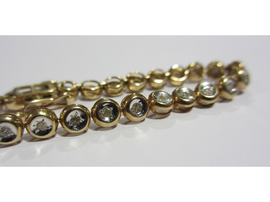 Appraisal: Nine carat gold diamond line bracelet