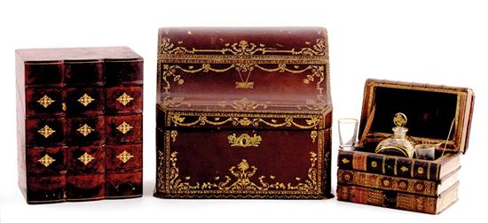 Appraisal: English tooled leather boxes and tantalus late th century oblong