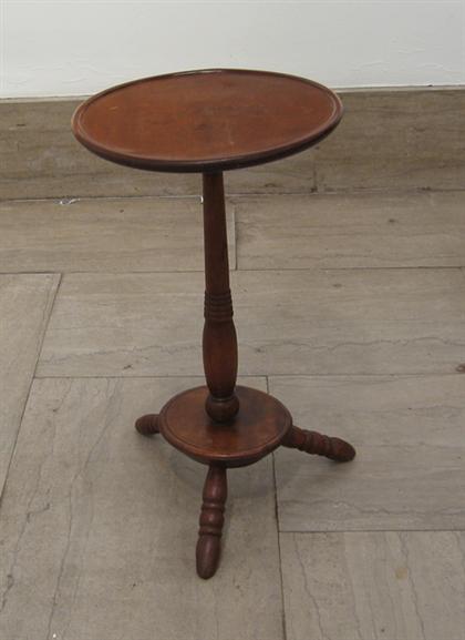 Appraisal: Walnut candlestand th century Dished circular top above turned support