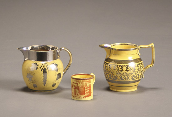 Appraisal: Two English Silver Lustre and Canary Yellow Glazed Pitchers and