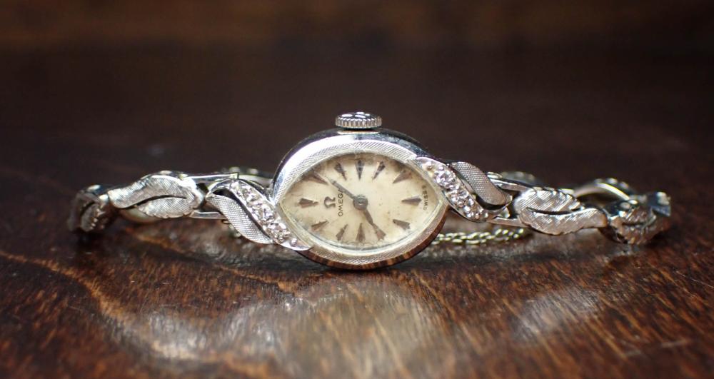 Appraisal: OMEGA DIAMOND AND FOURTEEN KARAT GOLD WATCH having a jewel