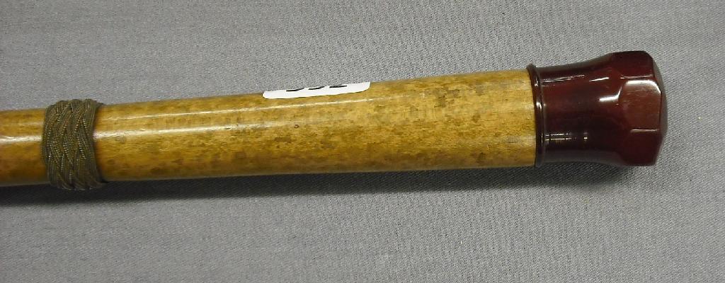 Appraisal: Interesting torchlight malacca walking cane with an amber knop long