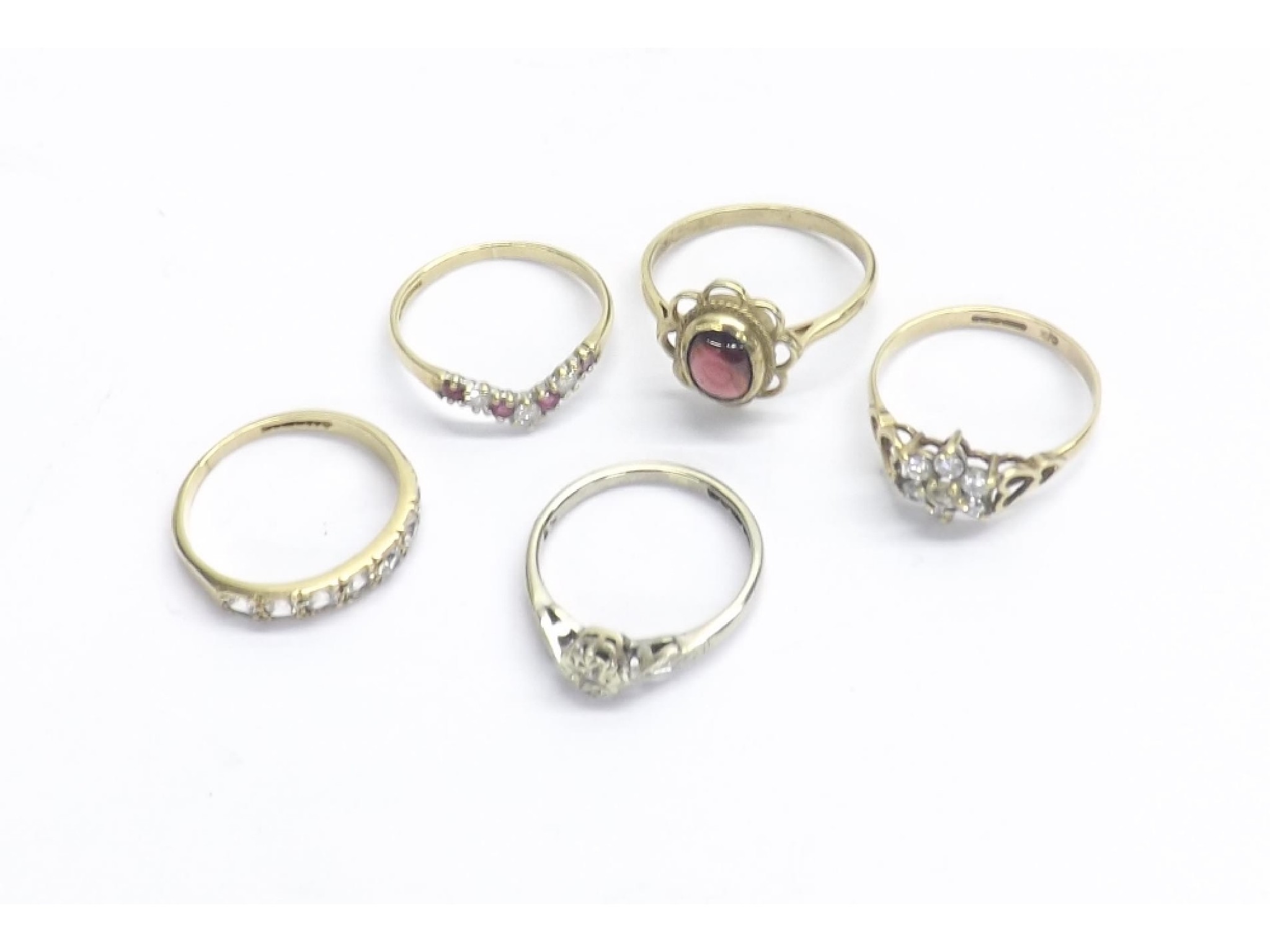 Appraisal: Ruby and diamond ct wishbone design ring together with four