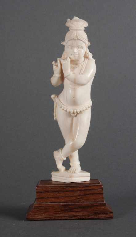 Appraisal: Indian carved ivory figure of a female flutist mounted on