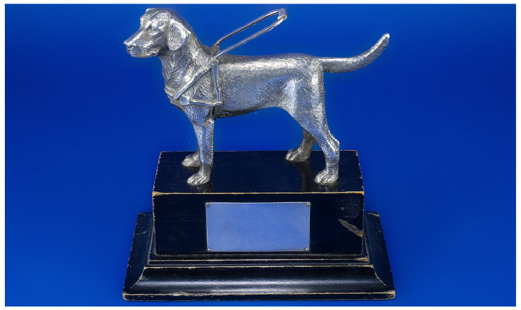 Appraisal: Silvered Model Of A Labrador Guide Dog On A Black