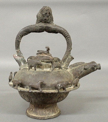 Appraisal: - Early Asian sand-cast bronze hot water kettle with face