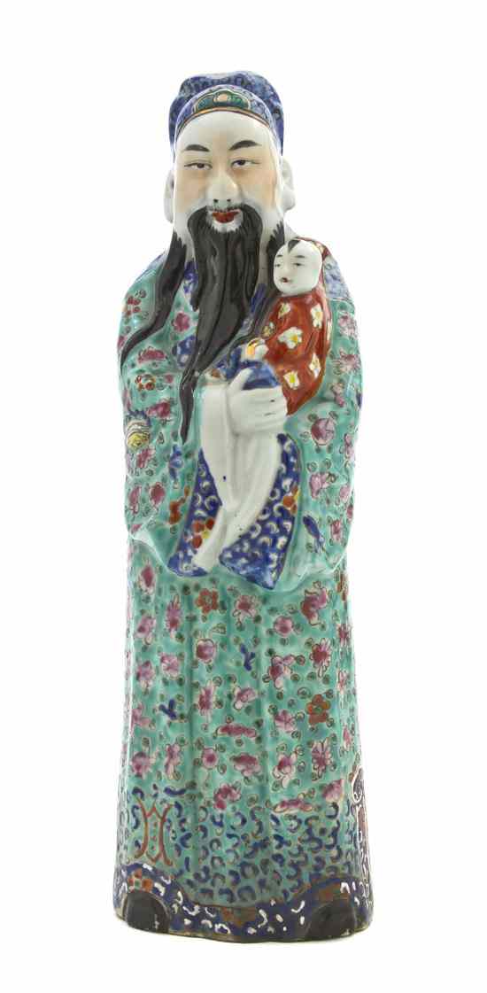 Appraisal: A Chinese Famille Rose Figure depicting a bearded gentleman holding