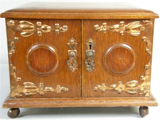 Appraisal: Late Victorian oak canteen box with applied copper mounts and